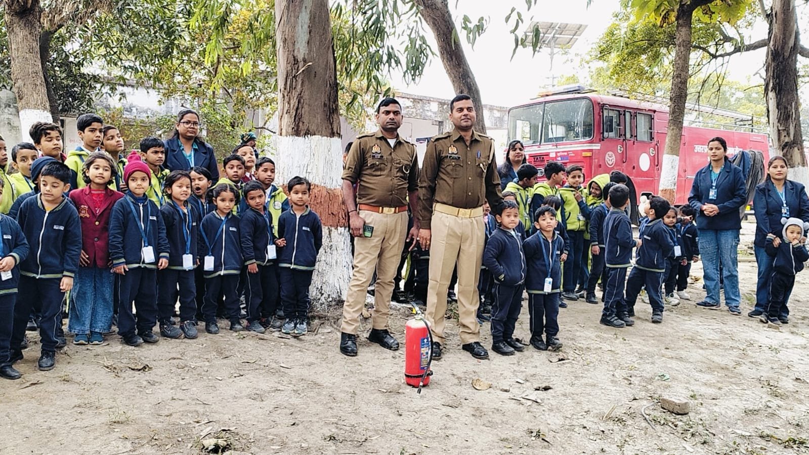 EuroKids children observing firefighting equipment during a Fire Station visit in Balrampur